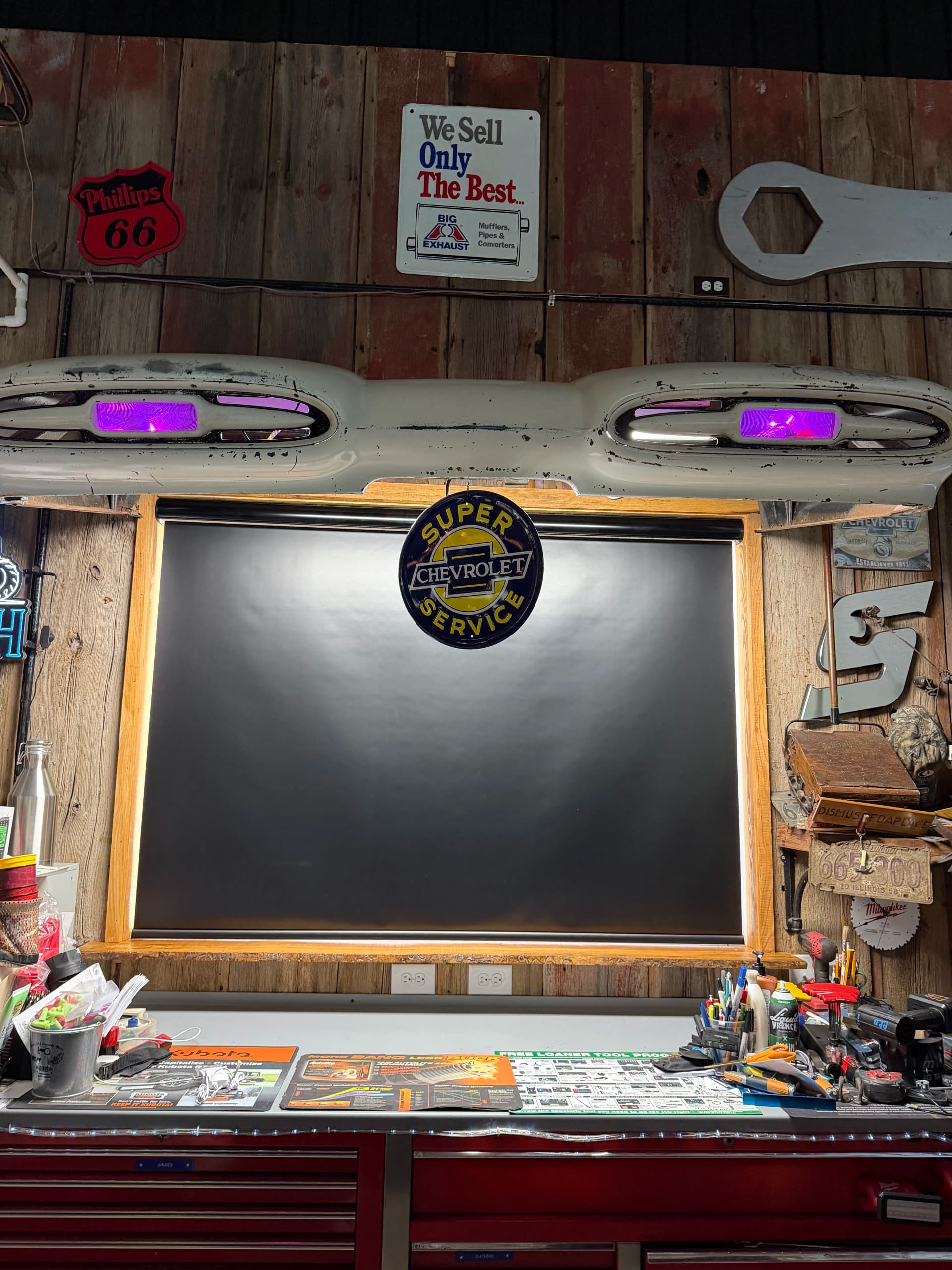 Black Motorized Roller Shade Installed in a Shop Workspace image
